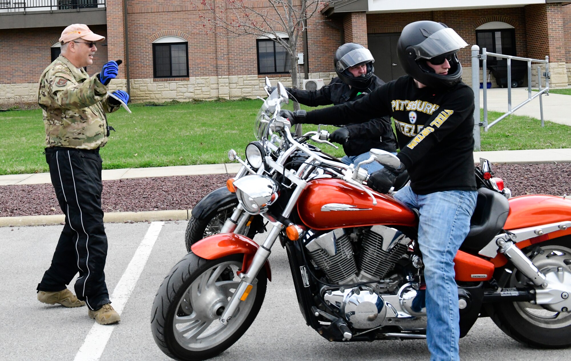 Senior Master Sgt. Vince Bartlomain, a standards and evaluation flight engineer assigned to the 910th Operations Group, instructs motorcycle safety participants on April 12, 2019, at a parking lot in YARS.