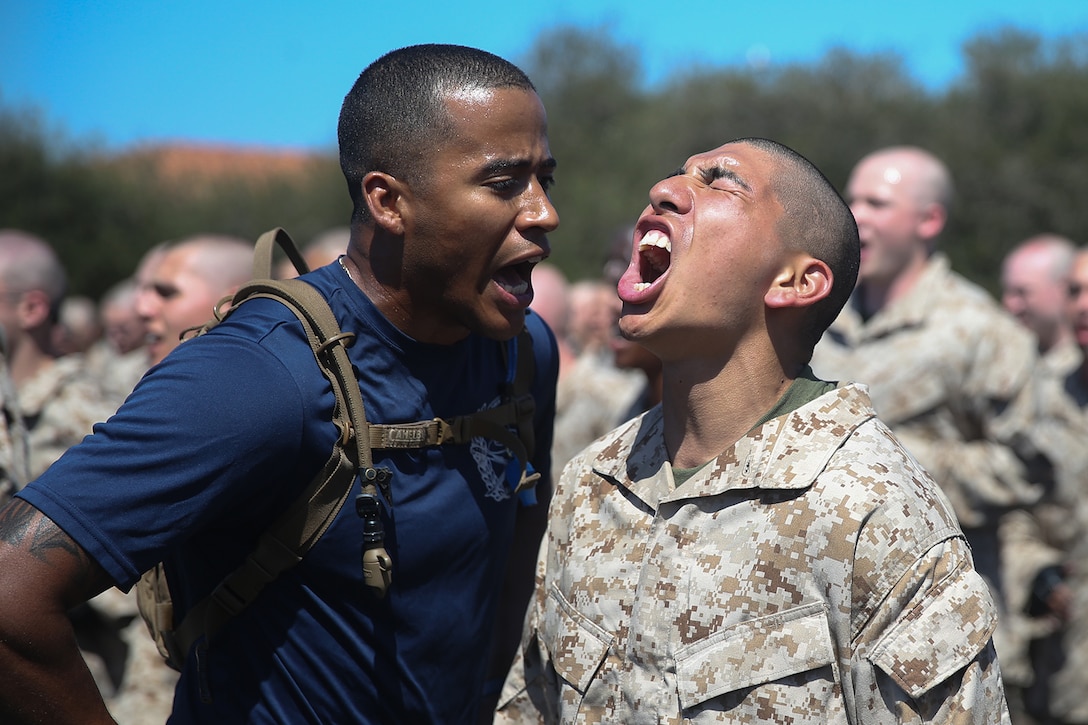 A Marine Corps recruit responds to orders.