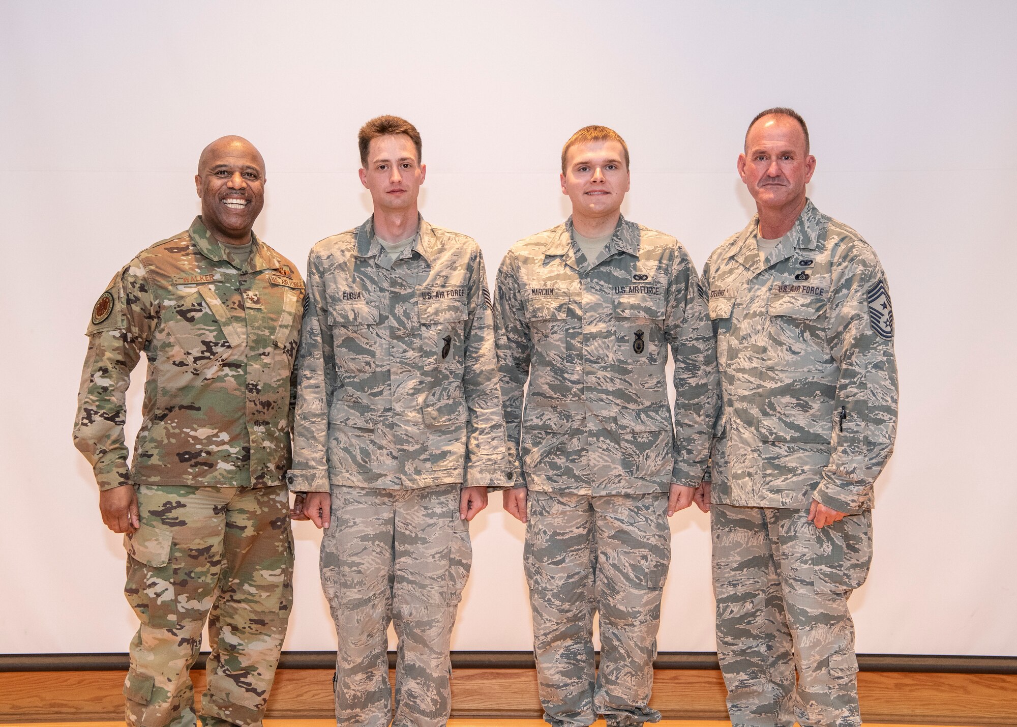 Brig. Gen. Christopher Walker, Assistant Adjutant General - Air; Sgt. Gregory Fuqua, West Virginia Air National Guard (WVANG) NCO of the Year; Senior Airman Christopher Marcum, WVANG Airman of the Year; and Command Chief Master Sgt. David Stevens, pose for a photo at the conclusion of the 2019 Best Warrior Competition held April 26-28, 2019, at Camp Dawson in Kingwood, W.Va. More than 22 Soldiers and Airmen from West Virginia and the District of Columbia participated in the three-day event designed to measure a Soldier or Airman’s physical abilities, leadership skills, teamwork and critical thinking while completing basic and advanced core warrior competencies. (U.S. Army National Guard Photo by Bo Wriston)
