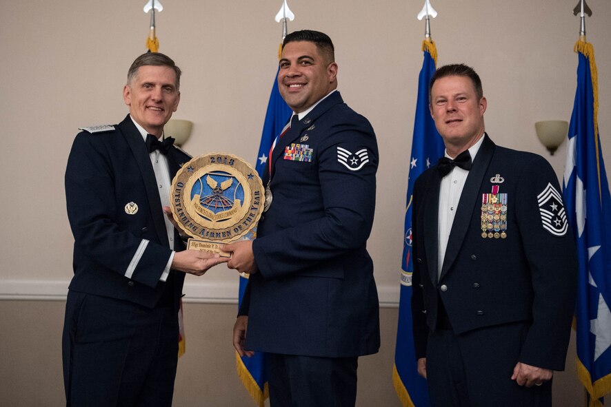 U.S. Air Force Staff Sgt. Dominic P.D. Garcia (middle), 7th Civil Engineer Squadron non-commissioned officer-in-charge of emergency management at Dyess Air Force Base, Texas, receives an Air Force Global Strike Command Outstanding Airmen of the Year award April 15, 2019, at Barksdale Air Force Base, La. The OAY award was awarded to six Airmen throughout AFGSC. (U.S. Air Force photo by Airman Jacob B. Wrightsman)