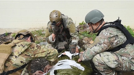 Instructors from the Tactical Combat Medical Care Course, or TCMCC, reenact a trauma scenario consisting of two segments - Care Under Fire and Tactical Field Care. The course is geared toward medical doctors, physician's assistants, nurses and senior medics in preparation for deployment to hostile environments. TCMCC prepares students for potential injuries and wounds they might encounter on the battlefield. The intense 5-day course is offered several times a year and is held at Joint Base San Antonio-Fort Sam Houston and JBSA-Camp Bullis.