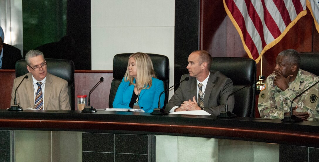 Left to right, Tim Morefield, chief of DLA Logistics Operations’ Planning Division; Emily Vogeler, chief strategy officer for DLA Logistics Operations; George Atwood, acting director of DLA Logistics Operations; and DLA Director Army Lt. Gen. Darrell Williams are seated behind a table