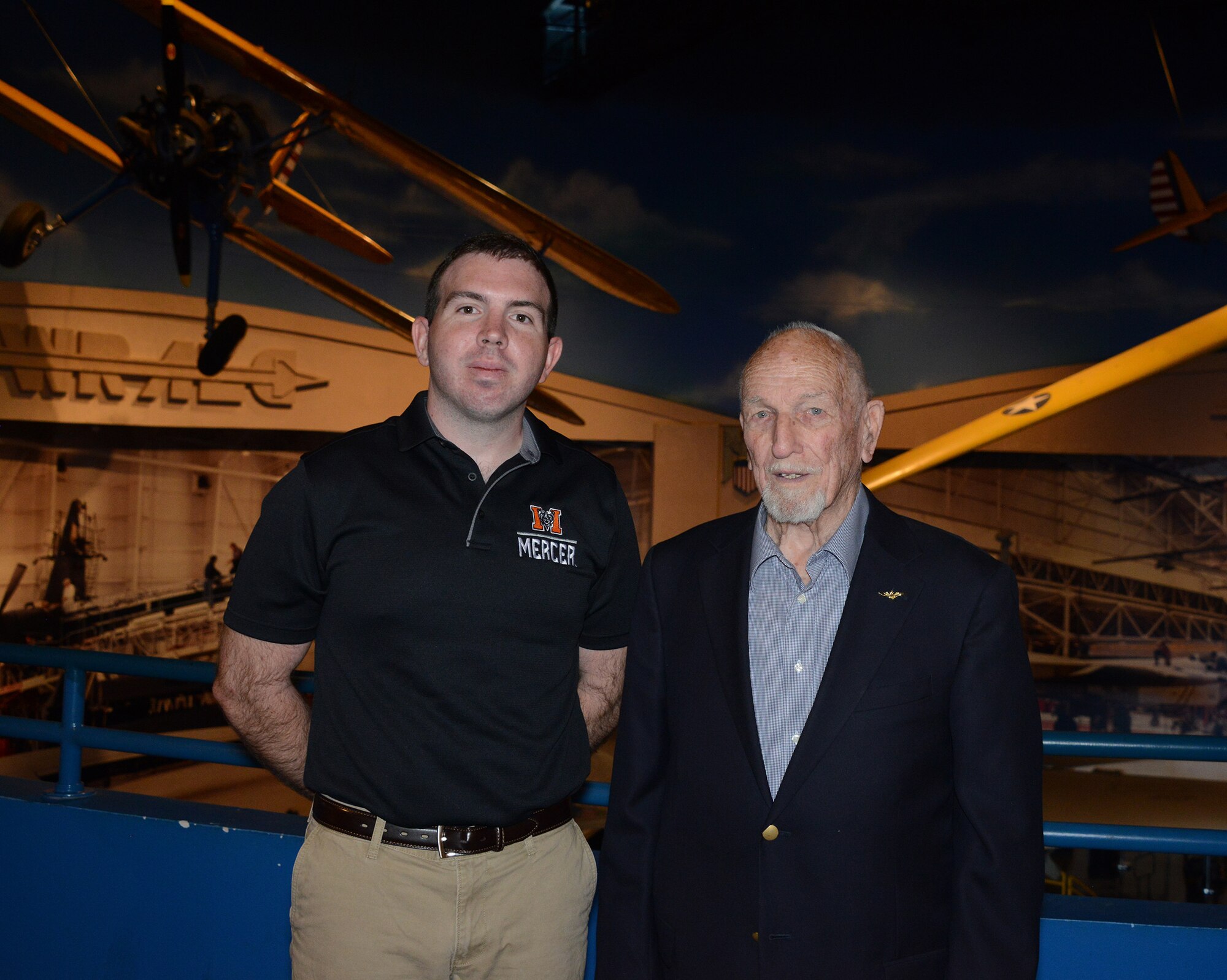 Ramon Carpenter, a retired United States Naval aviator, poses with his grandson after doing his commissioning oath at the Museum of Aviation at Robins Air Force Base, Georgia. Belflower joins a long list of family members who have served in the United States military. (Air Force photo/Master Sgt. Chance Babin)