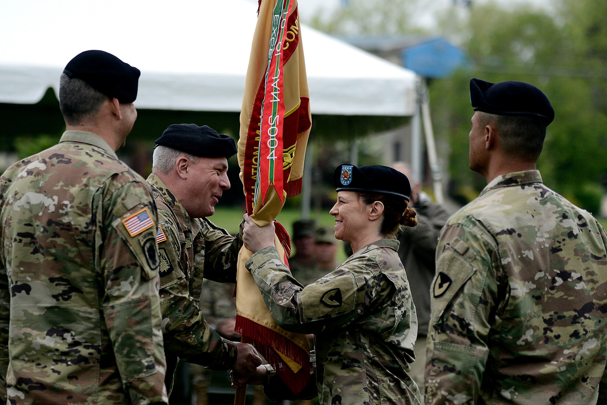U.S. Army Col. Charles W. Durr, U.S. Army Support Activity-Fort Dix commander, passes the unit colors to Command Sgt. Maj. Tamara A. Edwards, USASA-Fort Dix senior enlisted leader, during a change of responsibility ceremony at Joint Base McGuire-Dix-Lakehurst, New Jersey, April 30, 2019. Receiving the colors signifies gaining responsibility as the command sergeant major, the highest ranked noncommissioned officer at USASA, Fort Dix. (U.S. Air Force photo by Tech. Sgt. Austin Knox)