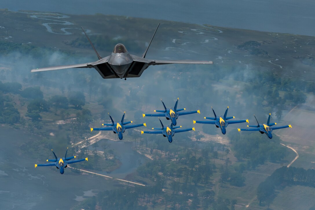 F-22s with Blue Angels