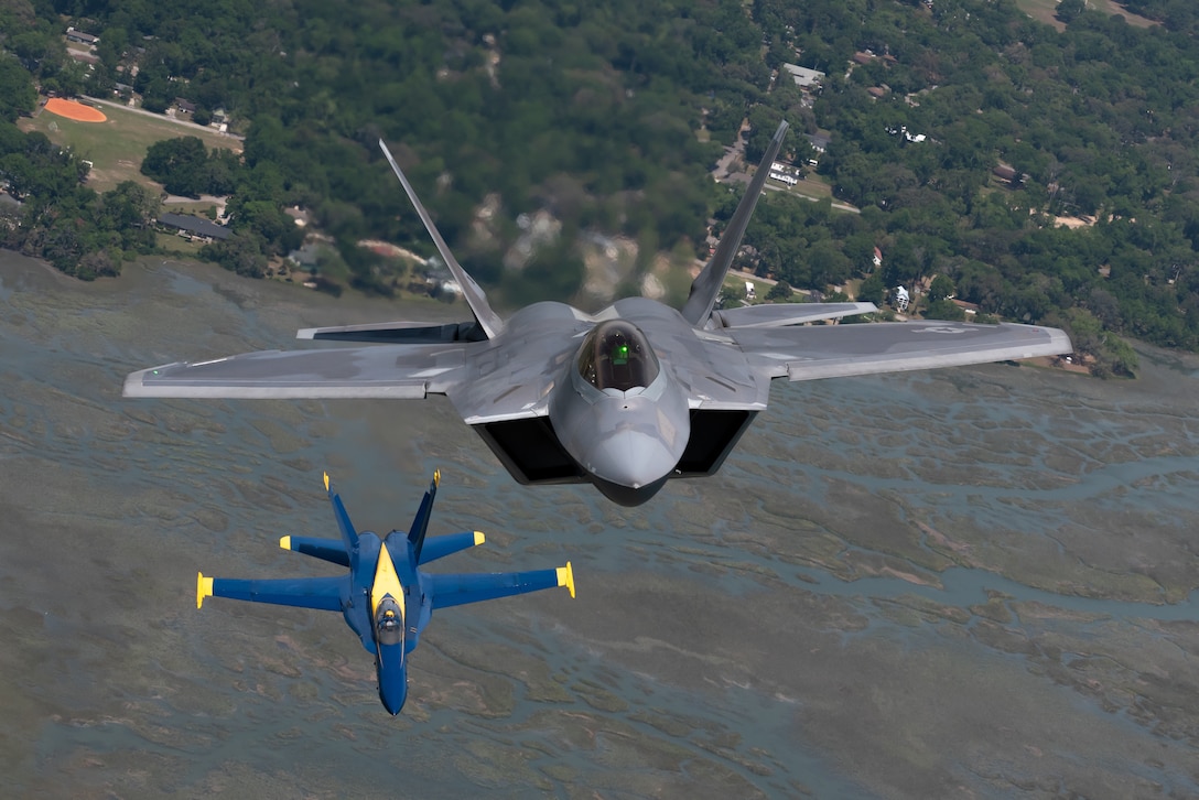 F-22s with Blue Angels