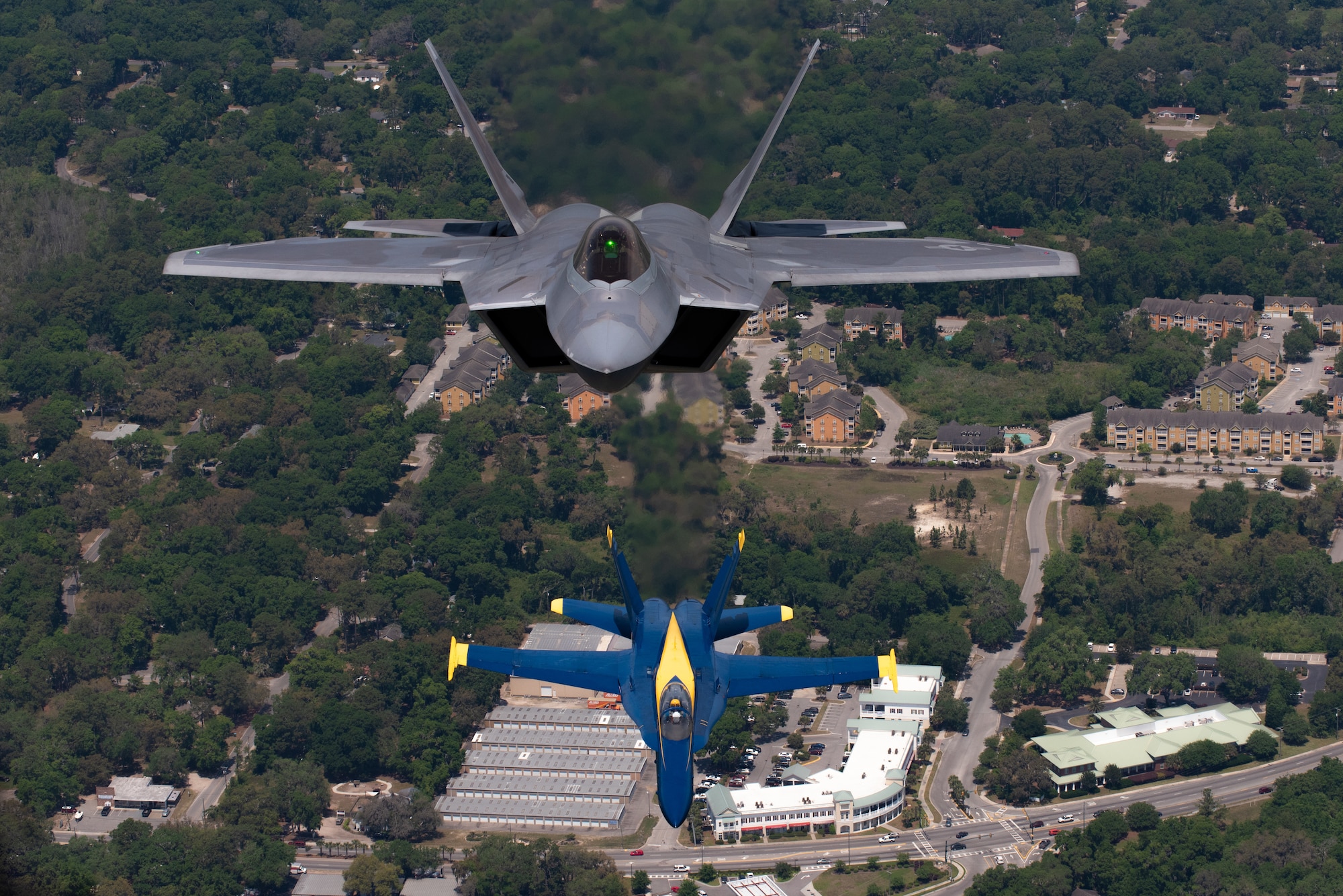 F-22s with Blue Angels