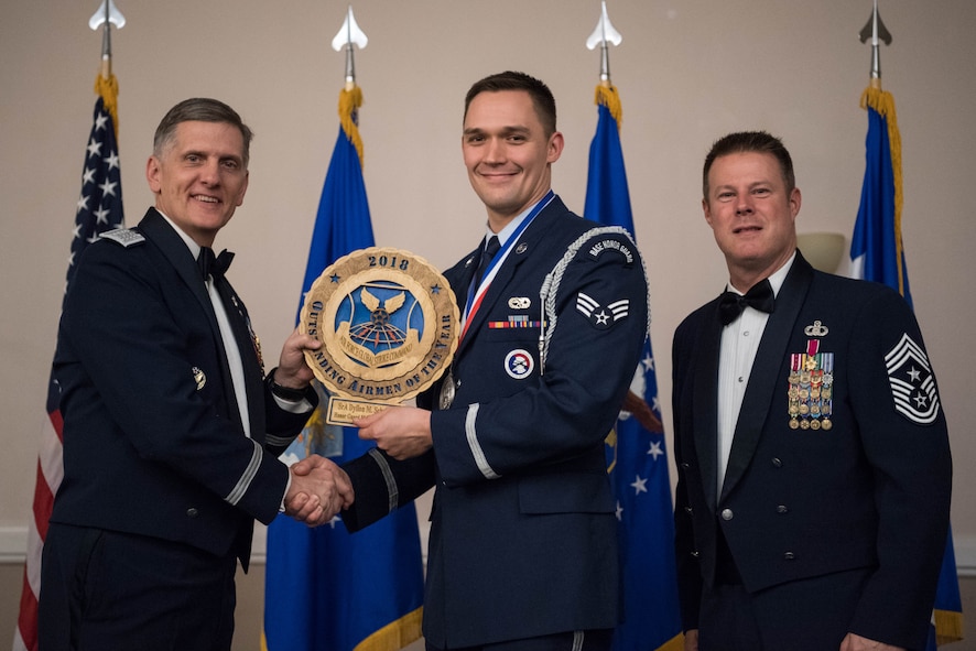 U.S. Air Force Senior Airman Dyllon M. Schwartz (middle), 28th Aircraft Maintenance Squadron honor guard flight trainer at Ellsworth Air Force Base, S.D., receives an Air Force Global Strike Outstanding Airmen of the Year award April 15, 2019, at Barksdale Air Force Base, La. The OAY award was awarded to six Airmen throughout AFGSC. (U.S. Air Force photo by Airman Jacob B. Wrightsman)