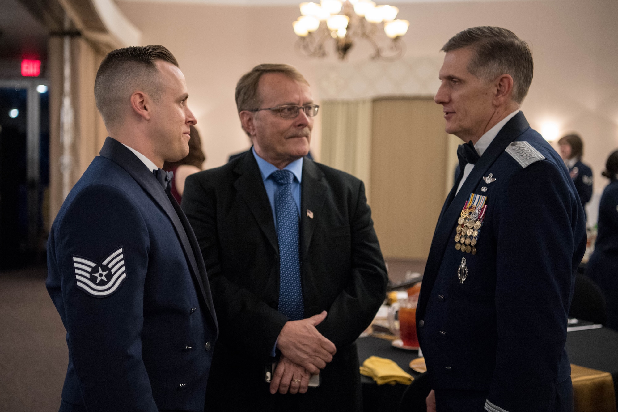 U.S. Air Force Tech. Sgt. Joshua D. White (left), 509th Force Support Squadron non-commissioned officer-in-charge of the base honor guard at Whiteman Air Force Base, Mo., and his father (middle) talk to Gen. Timothy Ray (right), Air Force Global Strike Command commander, at the AFGSC Outstanding Airmen of the Year award ceremony April 15, 2019, at Barksdale Air Force Base, La. The ceremony was hosted in honor of six Airmen who were selected as the most outstanding Airmen throughout AFGSC. (U.S. Air Force photo by Airman Jacob B. Wrightsman)