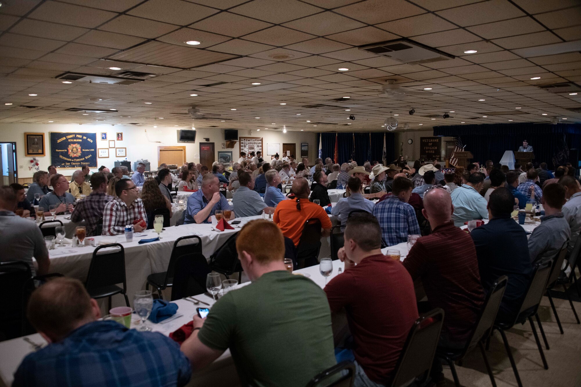 Members of the 40th Boom Symposium listen to the history of aerial refueling, during the Boom Symposium banquet,