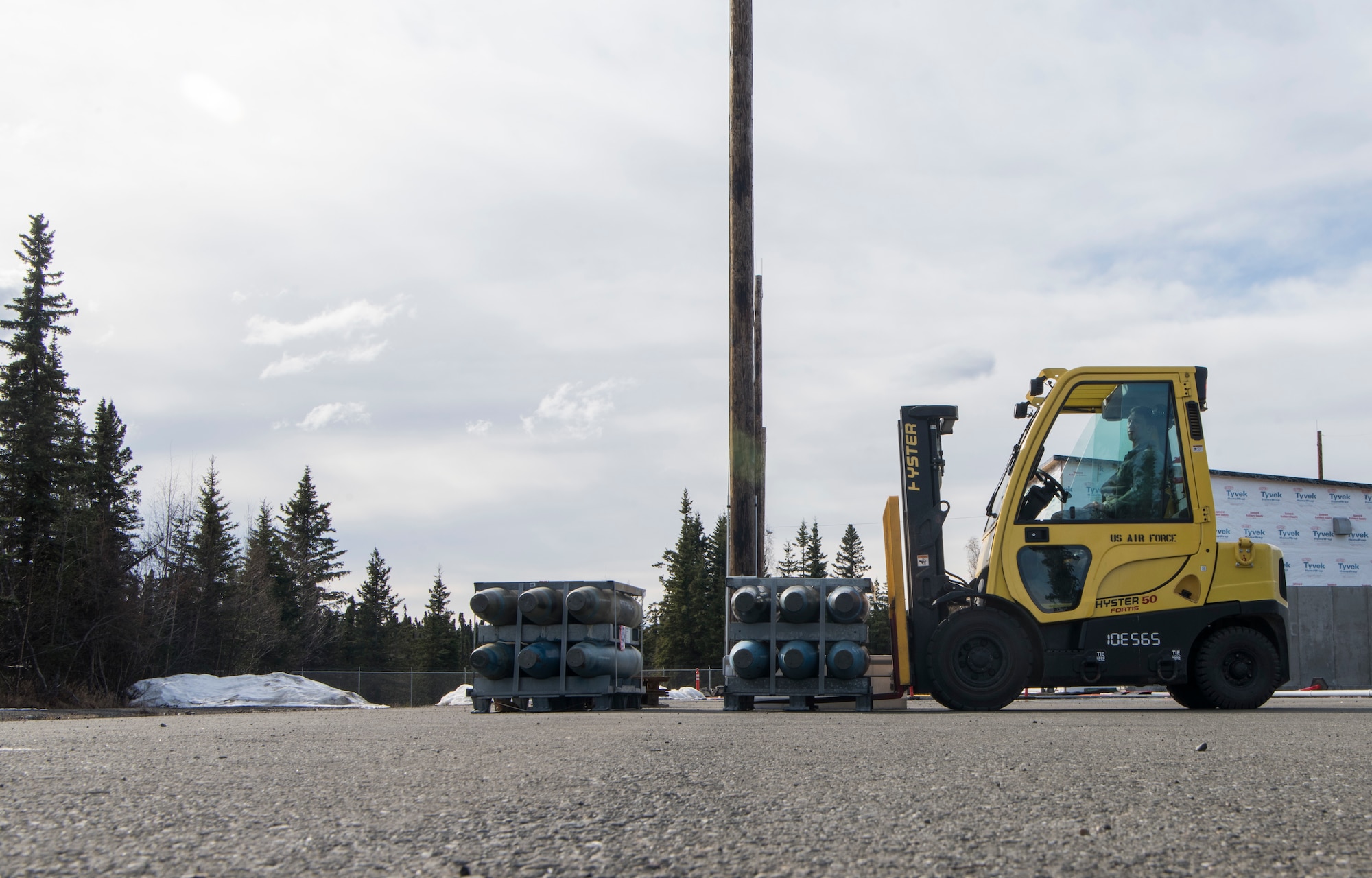 U.S. Air Force Senior Airman Brendon Malone, 3rd Munitions Squadron munitions stockpile management crew chief, prepares to move inert MK82 500-pound bomb bodies with an all-terrain forklift during the Spring Ammunition Barge arrival at Joint Base Elmendorf-Richardson, Alaska, April 24, 2019. The ammo barge contained six containers and over 50,000 pounds of munitions.