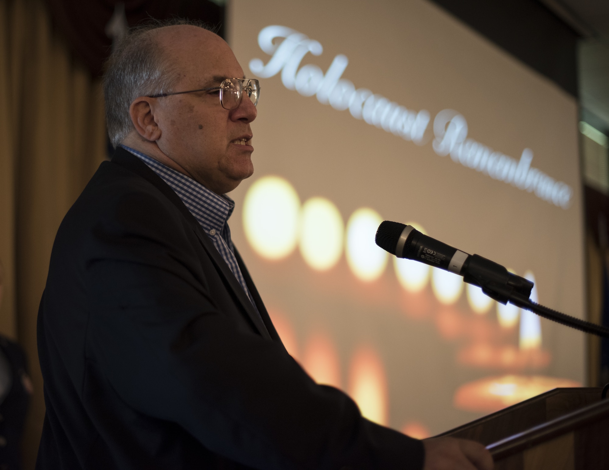 Phil Kirschner, New Jersey Commission on Holocaust Education chairman, speaks during the 2019 A Day of Remembrance ceremony on Joint Base McGuire-Dix-Lakehurst, New Jersey, April 30, 2019. Kirschner discussed what happened to families during the Holocaust and the injustice, hatred and prejudice they endured. (U.S. Air Force photo by Airman 1st Class Ariel Owings)