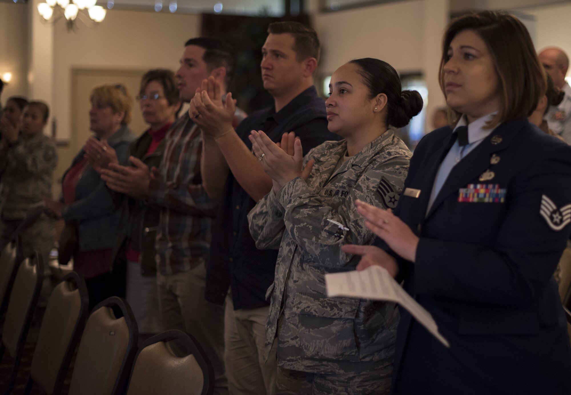 Audience members applaud during the 2019 A Day of Remembrance ceremony on Joint Base McGuire-Dix-Lakehurst, New Jersey, April 30, 2019. Military members from multiple services, family members and other Joint Base community members gathered to remember and honor those who suffered during the world’s largest recorded genocidal mass murder known as the Holocaust. (U.S. Air Force photo by Airman 1st Class Ariel Owings)