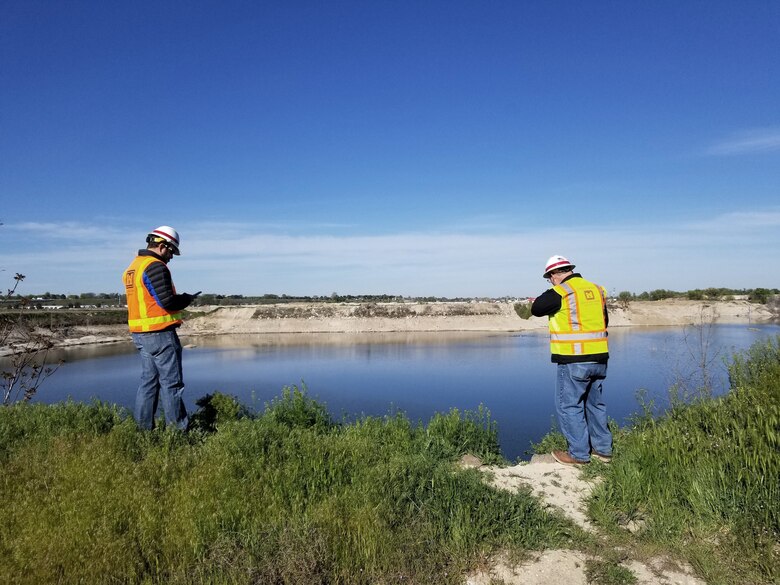 U.S. Army Corps of Engineers, Walla Walla District, Flood-Fight Specialists Michael Schaffer (left), a geotechnical engineer from the District Headquarters in Walla Walla, Washington, and Brandon Hobbs, a hydraulic engineer from the District’s Boise Field Office, monitor Boise River shoreline conditions May 2, 2019, at the Sunroc gravel pit near Eagle Island to support Ada County’s flood-season emergency response planning efforts.