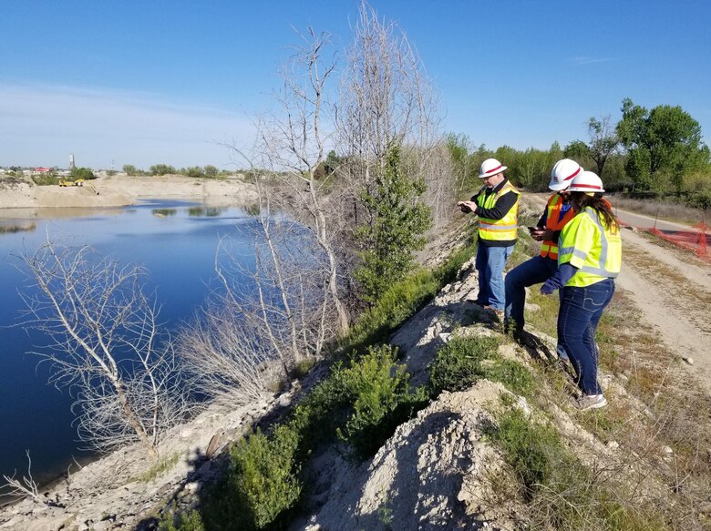 U.S. Army Corps of Engineers, Walla Walla District, Flood-Fight Specialists Michael Schaffer (left), a geotechnical engineer from the District Headquarters in Walla Walla, Washington, Brandon Hobbs, a hydraulic engineer from the District’s Boise Field Office, and Joy Hartl (right), a civil engineer from the District Headquarters, monitor Boise River shoreline conditions May 2, 2019, at the Sunroc gravel pit near Eagle Island to support Ada County’s flood-season emergency response planning efforts.