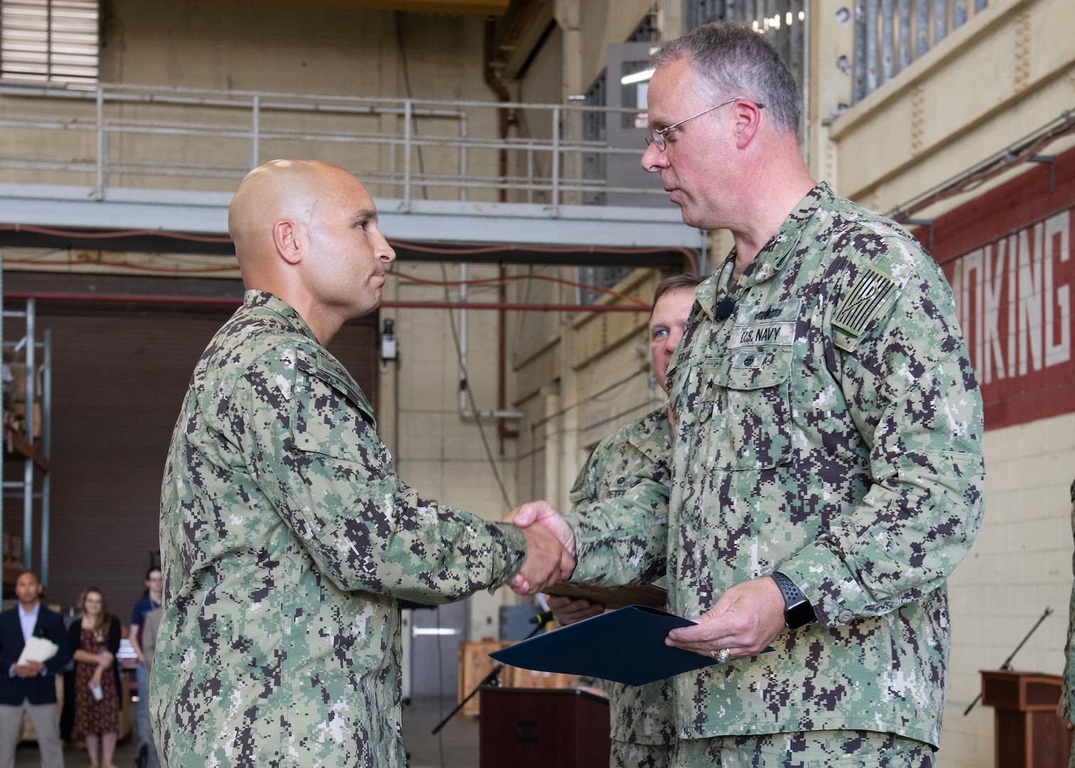 Commander, Naval Sea Systems Command Warfare Centers Rear Adm. Eric Ver Hage, presents Petty Officer 1st Class Joseph Rodriguez, Naval Surface Warfare Center Panama City Division (NSWC PCD) dive locker leading petty officer and diving supervisor, letter of commendation for Sailor of the Quarter during an All Hands at NSWC PCD May 1.