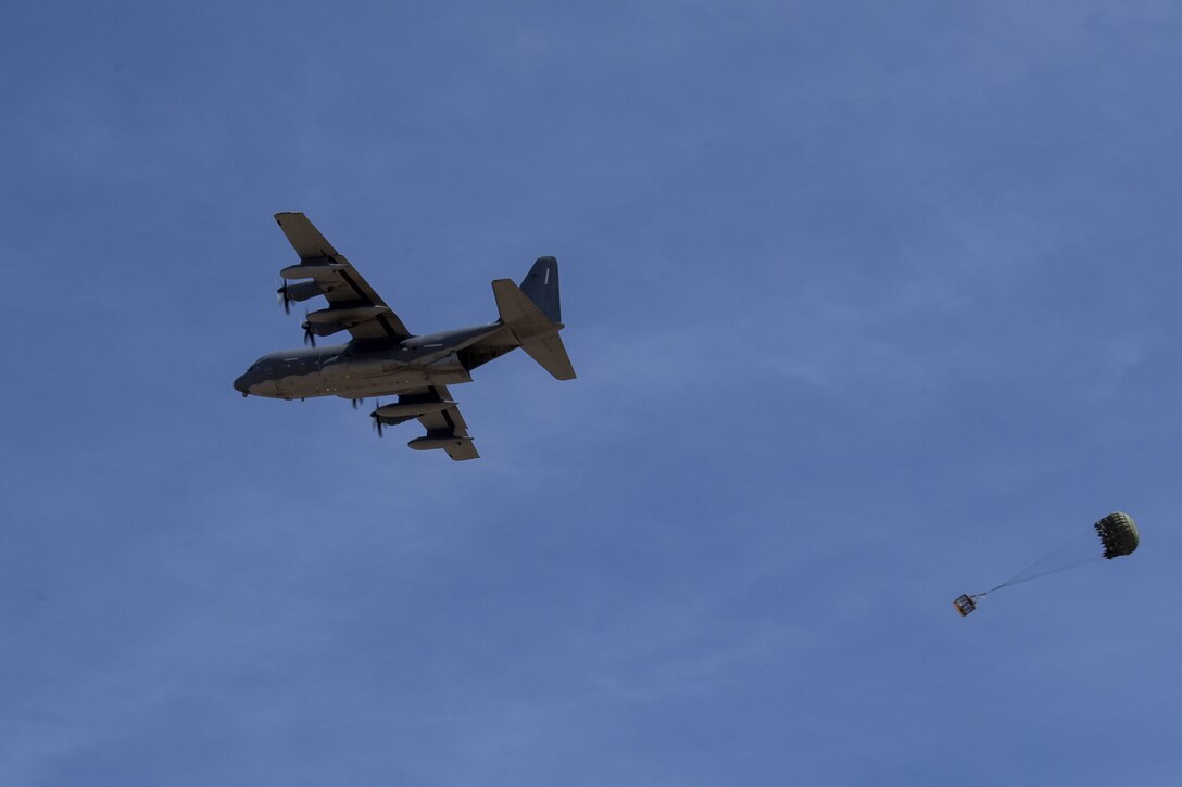 A 415th Special Operations Squadron HC-130J Combat King II aircrew performs an air drop of a container delivery system April 9, 2019, at Kirtland Air Force Base, N.M. The AD Flight is primarily responsible for preparing and packing any air drops that the 415th Special Operations Squadron needs to accomplish their training mission. They are also at the ready to ensure mission success for the region and flow through traffic or missions that are serviced by the 377th Air Base Wing.(U.S. Air Force photo by Staff Sgt. Dylan Nuckolls)