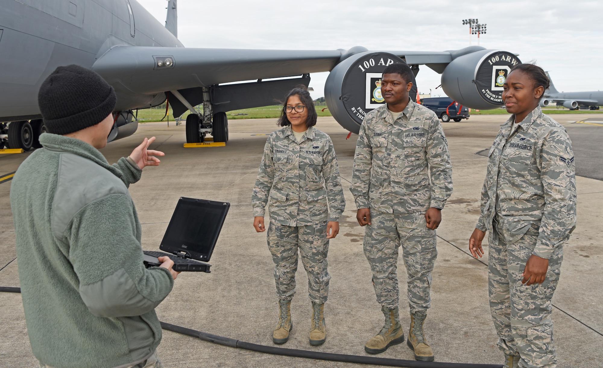 Airmen with the 100th Aircraft Maintenance Squadron go over technical orders at RAF Mildenhall, May 2, 2019. During upgrade training, Airmen must complete tasks such as the recovery of aircraft, call flight controls prior to a launch and marshaling aircraft. (U.S. Air Force photo by Airman 1st Class Brandon Esau)