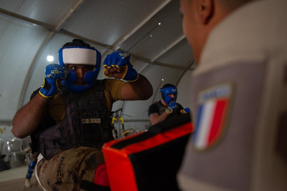 Task Force Narvik personnel conduct a High Intensity Close Combat Training course at the Iraq Counter-Terrorist Defense Academy. The objective of the course is to train Iraqi cadres in close combat so they can in turn train their soldiers.