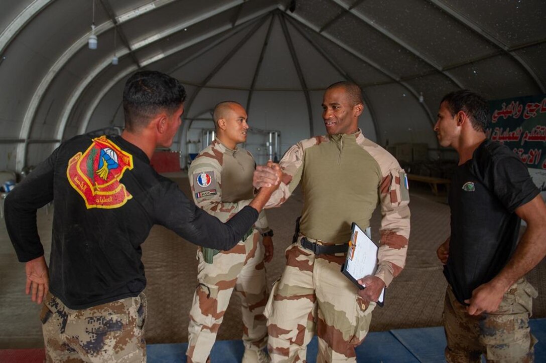 Task Force Narvik personnel conduct a High Intensity Close Combat Training course at the Iraq Counter-Terrorist Defense Academy. The objective of the course is to train Iraqi cadres in close combat so they can in turn train their soldiers.