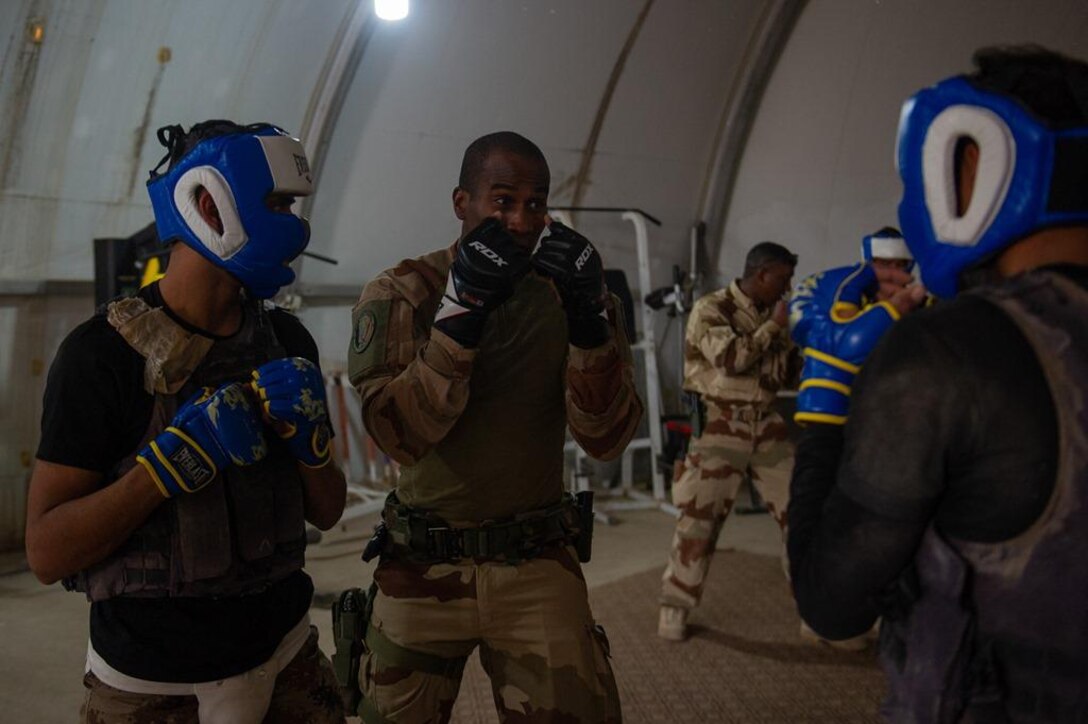 Task Force Narvik personnel conduct a High Intensity Close Combat Training course at the Iraq Counter-Terrorist Defense Academy. The objective of the course is to train Iraqi cadres in close combat so they can in turn train their soldiers.