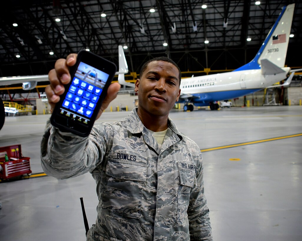 Maintainers of C-40C aircraft need a variety of physical tools in their toolboxes to work on planes.  For keeping up with unit news, Senior Airman Aaron Bowles, 932nd Airlift Wing Maintenance Squadron, shows off his latest hand held tool, the "932nd Airlift Wing Mobile App" on May 1, 2019, at Scott Air Force Base, Illinois.
