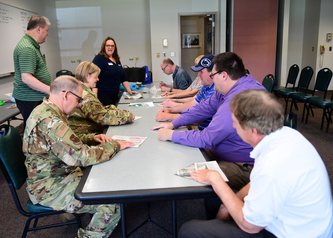 Personnel assigned to the 911th Airlift Wing, listen to instructions at the Pittsburgh International Airport Air Reserve Station, Pennsylvania, May 2, 2019. The instructor taught them how to fold a newspaper into a plant pot. (U.S. Air Force Photo by Senior Airman Grace Thomson)