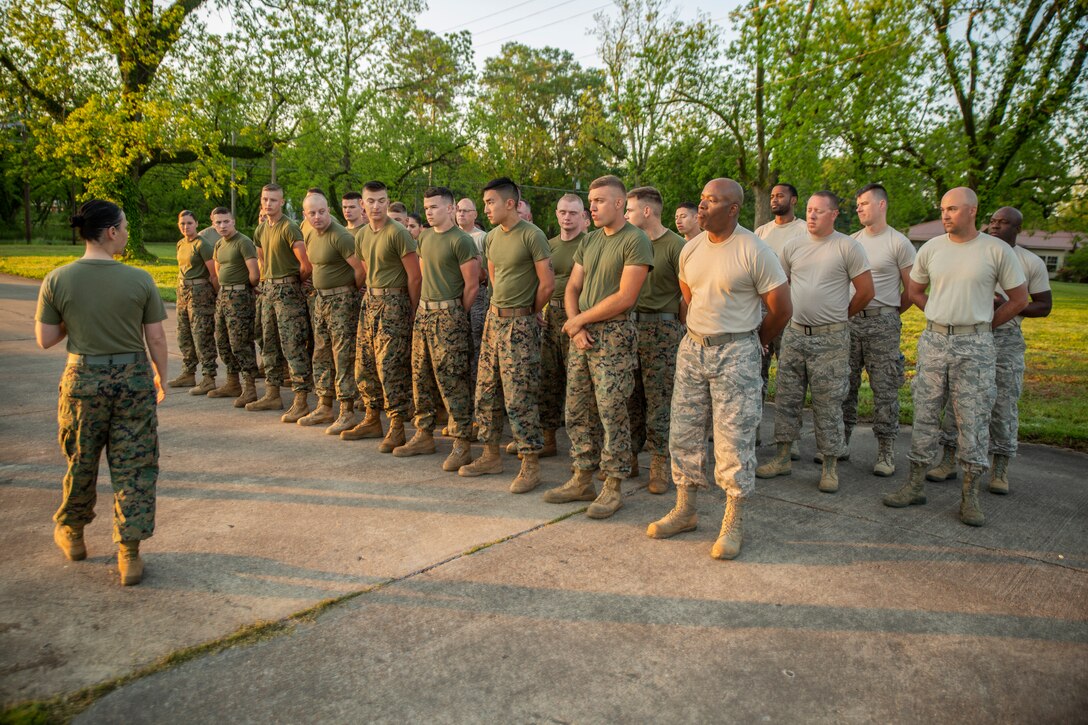 Marines and Airmen prepare for a motivational run at Crystal Springs, Miss., on April 26, 2019. The Marines and Airmen are part of the Department of Defense’s Innovative Readiness Training Camp Kamassa near Crystal Springs. The program supports the community by pairing military members with civil projects that benefit the community, and enables Marine Reserve units to increase their efficiency and performance. (U.S. Marine Corps photo by Lance Cpl. Jose Gonzalez)