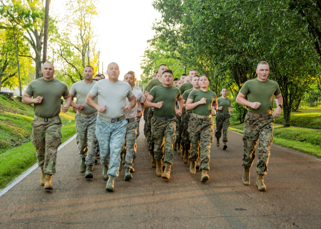 Marines and Airmen conduct a motivational run at Crystal Springs, Miss., on April 26, 2019. The Marines and Airmen are part of the Department of Defense’s Innovative Readiness Training Camp Kamassa near Crystal Springs. The program supports the community by pairing military members with civil projects that benefit the community, and enables Marine Reserve units to increase their efficiency and performance. (U.S. Marine Corps photo by Lance Cpl. Jose Gonzalez)