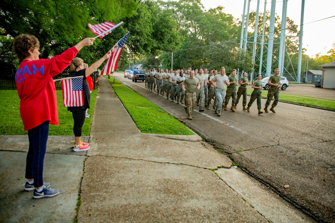 Marines and Airmen conduct a motivational run at Crystal Springs, Miss., on April 26, 2019. The Marines and Airmen are part of the Department of Defense’s Innovative Readiness Training Camp Kamassa near Crystal Springs. The program supports the community by pairing military members with civil projects that benefit the community, and enables Marine Reserve units to increase their efficiency and performance. (U.S. Marine Corps photo by Lance Cpl. Jose Gonzalez)