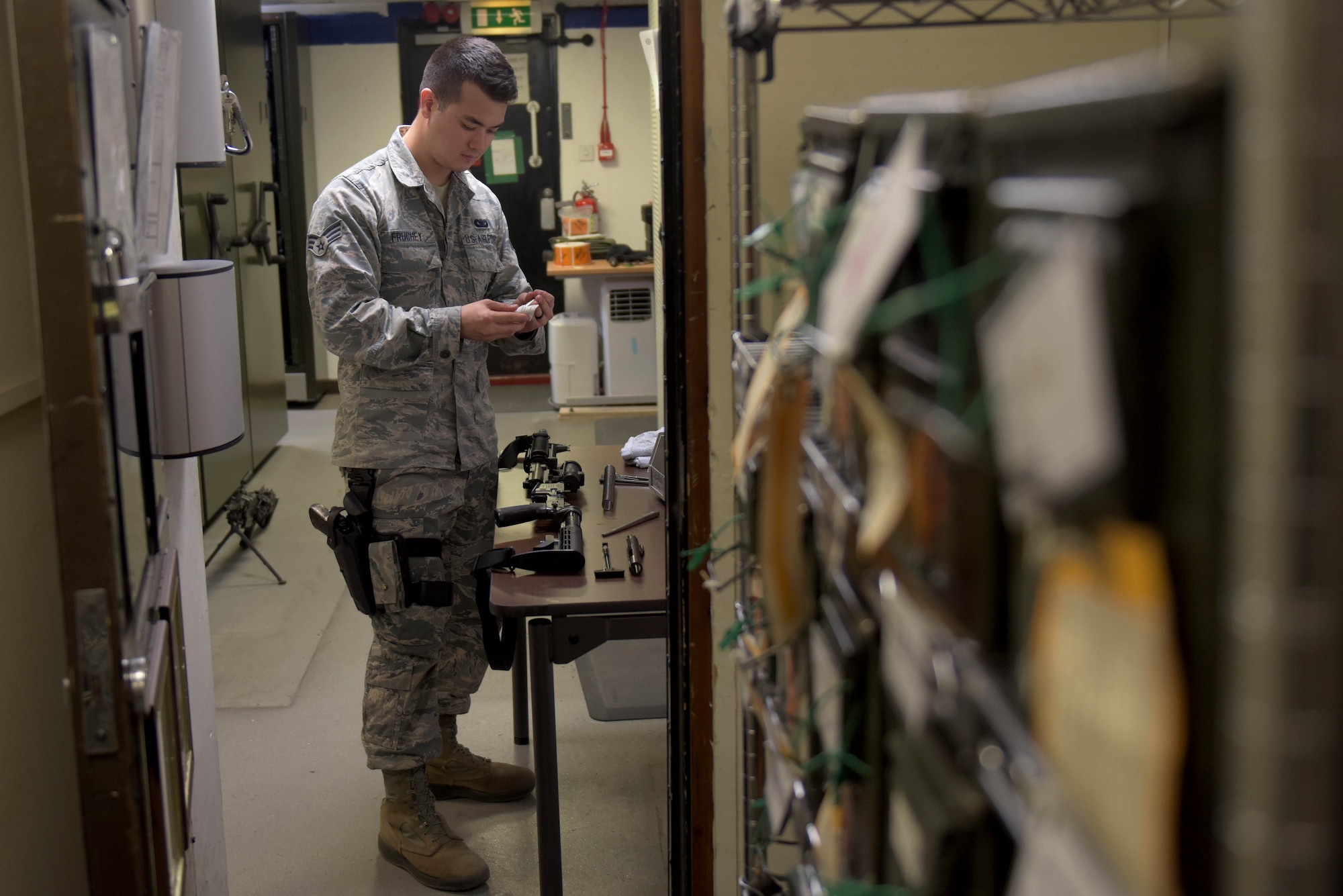 U.S. Air Force Senior Airman William Fruchey, 100th Security Forces Squadron armorer, cleans an M-4 carbine in the armory at RAF Mildenhall, England, May 2, 2019. All weapons are cleaned after each use. (U.S. Air Force photo by Senior Airman Benjamin Cooper)