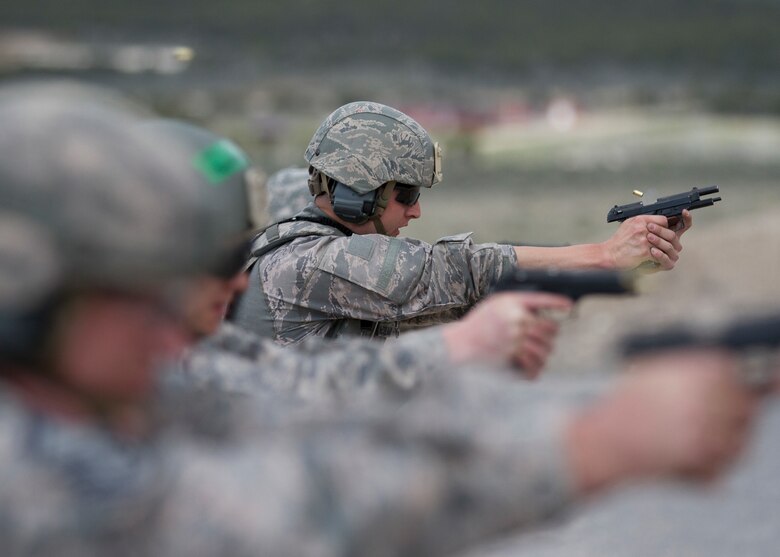 Security Forces members conduct M4 rifle and M9 pistol training
