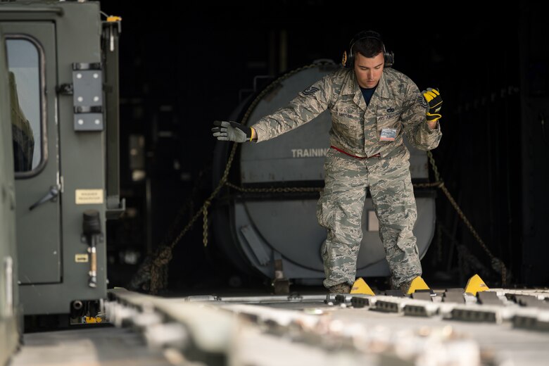 Tech. Sgt. Patrick Lerman, 70th Aerial Port Squadron air transportation specialist, Homestead Air Force Base, Fla, competes in the Halvorsen 25K Loader Obstacle Course