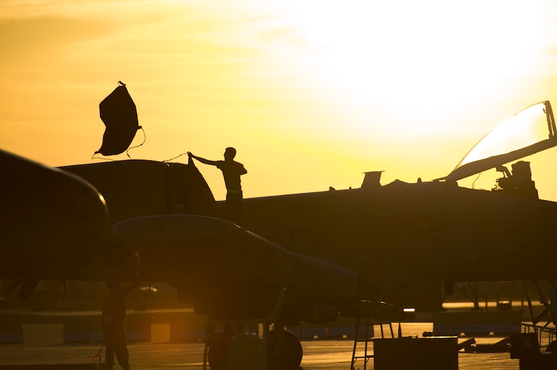 A crew chief works on an A-10 Thunderbolt