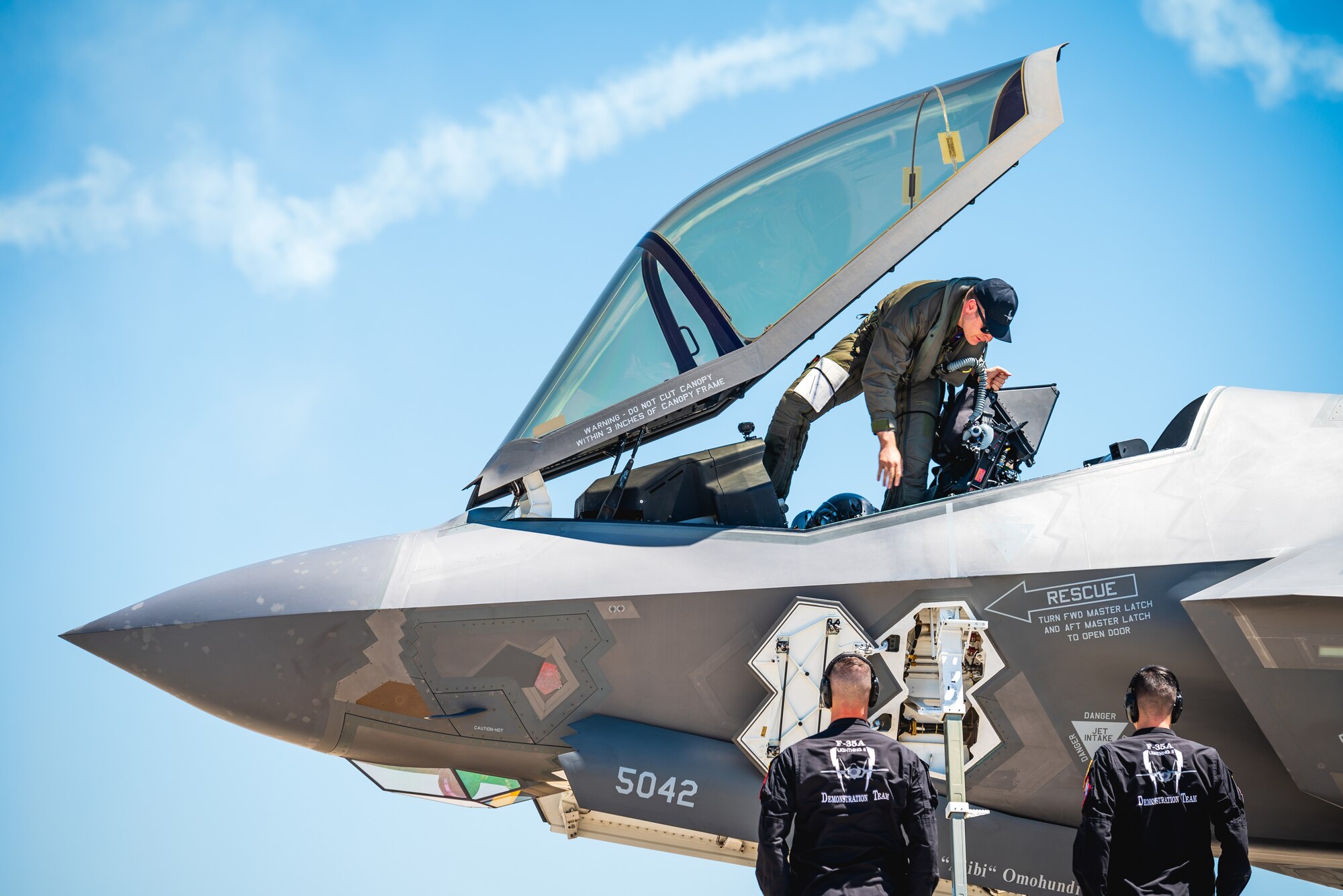 A pilot climbs out of an F-35A Lightning II