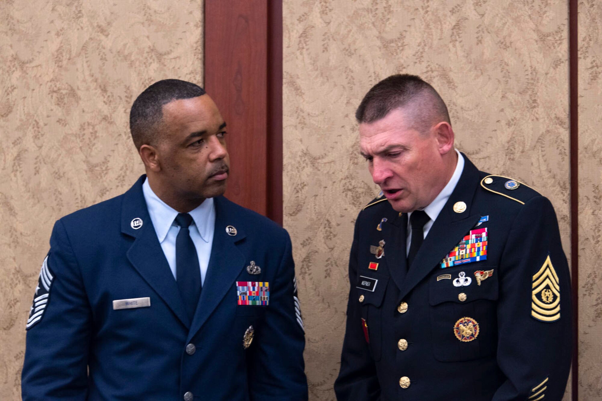 Chief Master Sgt Timothy White Jr., Senior Enlisted Advisor to the Chief of the Air Force Reserve, Pentagon, Washington D.C. and Command Chief Master Sergeant of Air Force Reserve Command, Robins Air Force Base, Georgia speaks with Command Sgt Maj Christopher Kepner, Senior Enlisted Advisor to the Chief of the National Guard Bureau before breakfast at the House National Guard and Reserve Component Caucus Breakfast at the U.S Capitol, Washington D.C., April 30, 2019. (U.S. Air Force photo by SrA Andreaa Phillips)