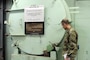 U.S. Army Corps of Engineers, Baltimore District commander Col. John Litz examines the containment vessel door of the SM-1A Deactivated Nuclear Power Plant April 24, 2019 during a site visit. SM-1A will be decommissioned and dismantled by the U.S. Army Corps of Engineers, Baltimore District, with its Radiological Center of Expertise, and in partnership with Fort Greely Garrison and Alaska District. Part of this dismantling and decommissioning effort will involve segregating components of the co-located, still operational steam plant from where the decommissioning will take place.