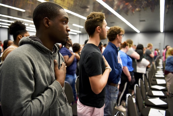 Students attending the Lowndes County Senior Breakfast stand for the national anthem May 1, 2019, at the East Mississippi Community College in Mayhew, Miss. The event was an opportunity to connect with seniors across numerous high schools near EMCC, helping open their mind to the importance of voting, making the right choices and working toward their goals in the near future. (U.S. Air Force photo by Airman 1st Class Keith Holcomb)