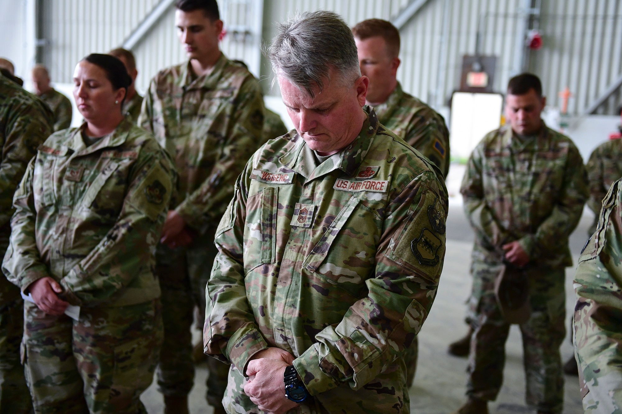 Airmen form the 22d Expeditionary Air Refueling Squadron bow their heads during the Shell 77 memorial ceremony, May 3, 2019, at Incirlik Air Base, Turkey. The 22d EARS commemorated the brave aircrew of Shell 77 who paid the ultimate sacrifice while conducting a combat aerial refueling mission six years ago by conducting 77 seconds of silence. (U.S. Air Force photo by Staff Sgt. Ceaira Tinsley)