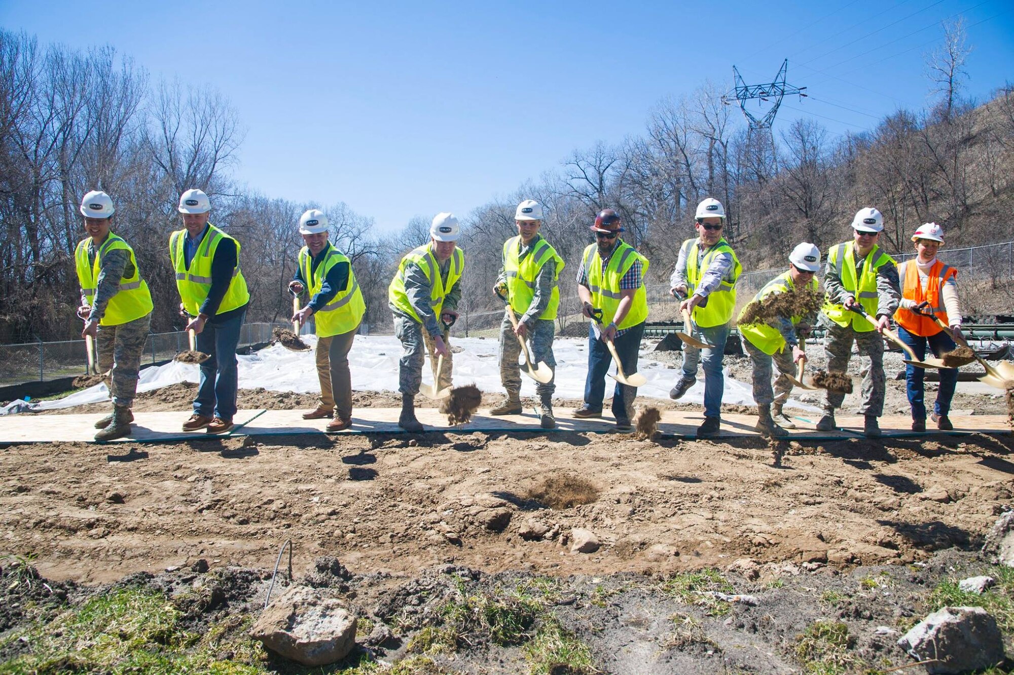 934th Airlift Wing Airmen, LS Black Constructors, and the representatives from the Army Corp of Engineers break ground on an indoor firing range project located near the Minneapolis-St. Paul Air Reserve Station, Minn., Apr. 19, 2019.