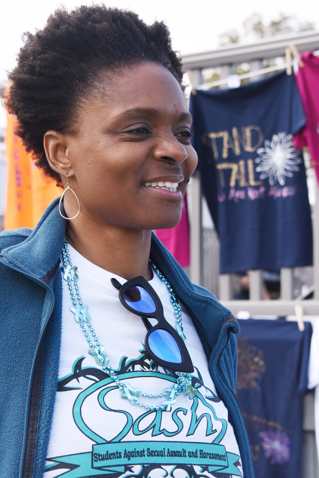 Dawn Holmes, a sexual assault prevention and response victim advocate at DLIFLC, shows off her SASH t-shirt during a Teal Run held April 26, 2019. Holmes was recently named Exceptional Military Victim Advocate of 2019, in a ceremony held in Washington, D.C. (Courtesy photo)