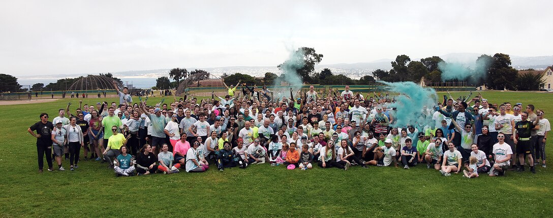 Runners pause for a photo op after the Teal Run, a Sexual Assault Prevention Response event, held at Defense Language Institute Foreign Language Center. (Courtesy photo)