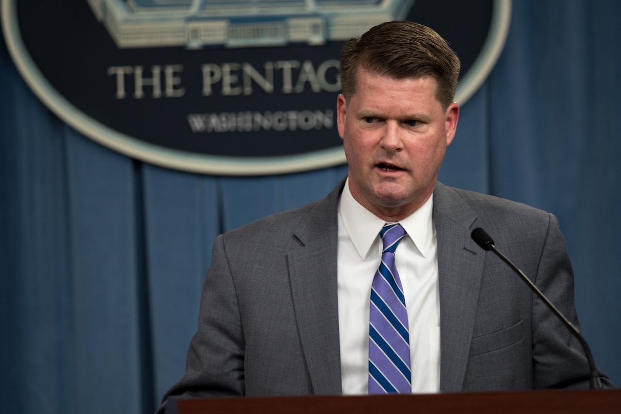 A man speaks at a Pentagon podium.