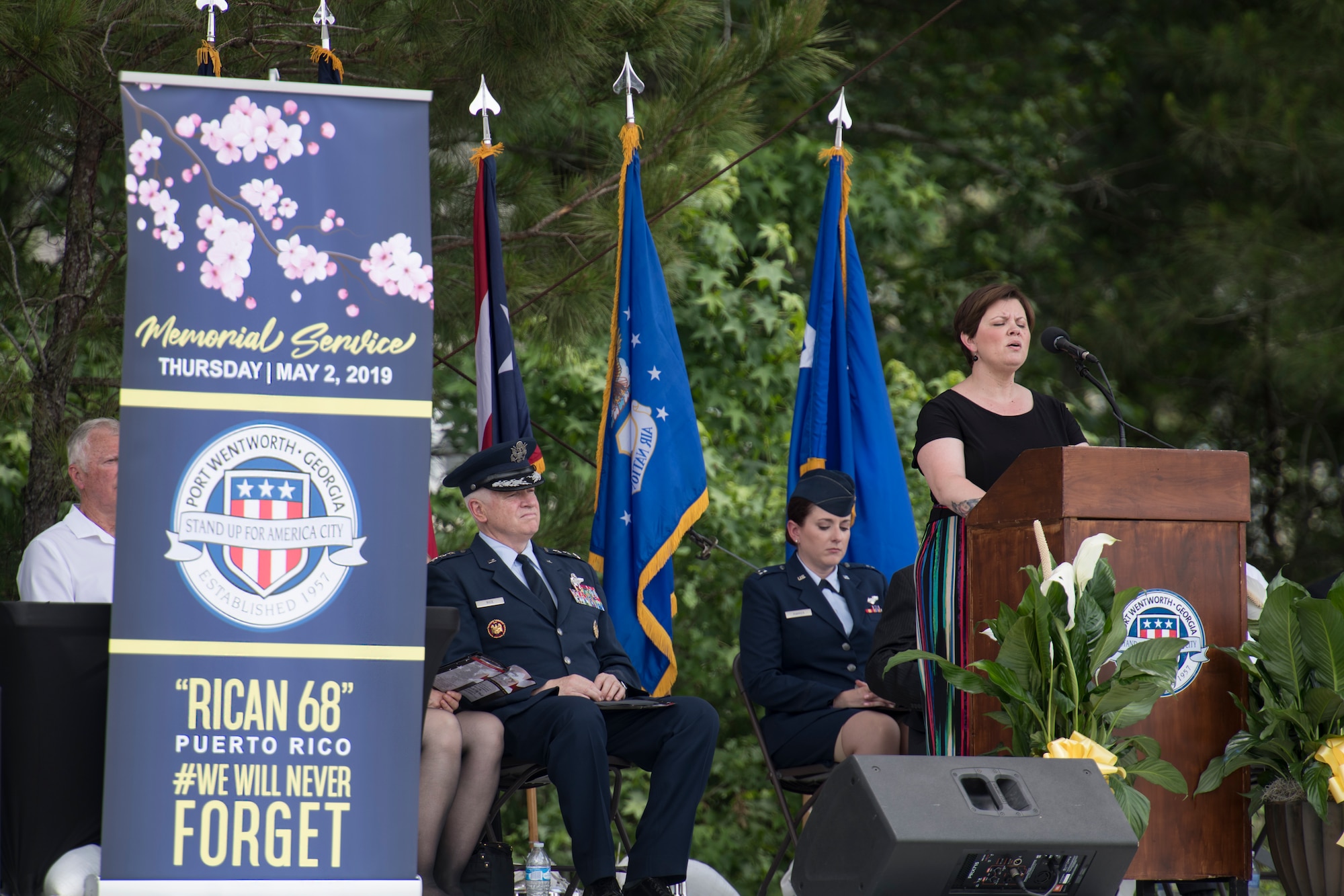 Amy Brackett sings “Amazing Grace” May 2, 2019, during a memorial service in Port Wentworth, GA, honoring the nine Airmen assigned to the 156th Airlift Wing who lost their lives in a C-130 Hercules crash May 2, 2018.