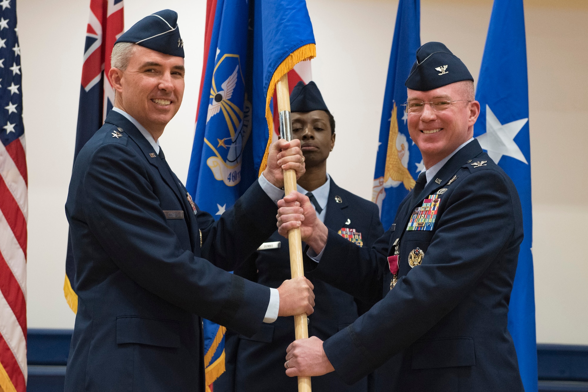 Maj. Gen. Stephen Whiting, 14th Air Force commander, receives the guidon from Col. Troy Endicott, 460th Space Wing outgoing commander, during a change of command ceremony May 3, 2019, on Buckley Air Force Base, Colorado.