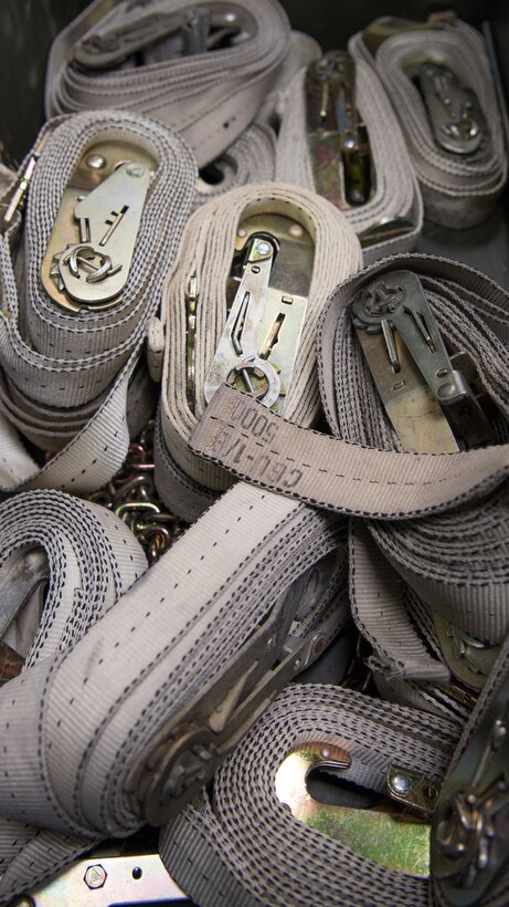 A bucket of straps is placed inside a Rapid Assistance Support for Calibration (RASCAL) unit Jan. 14, 2019, on Mountain Home Air Force Base, Idaho. The RASCAL is deployable work center that was filled with equipment that needed to be strapped down before is it deployed to Joint Base Pearl Harbor - Hickam, Hawaii. (U.S. Air Force photo by Airman First Class Andrew Kobialka)