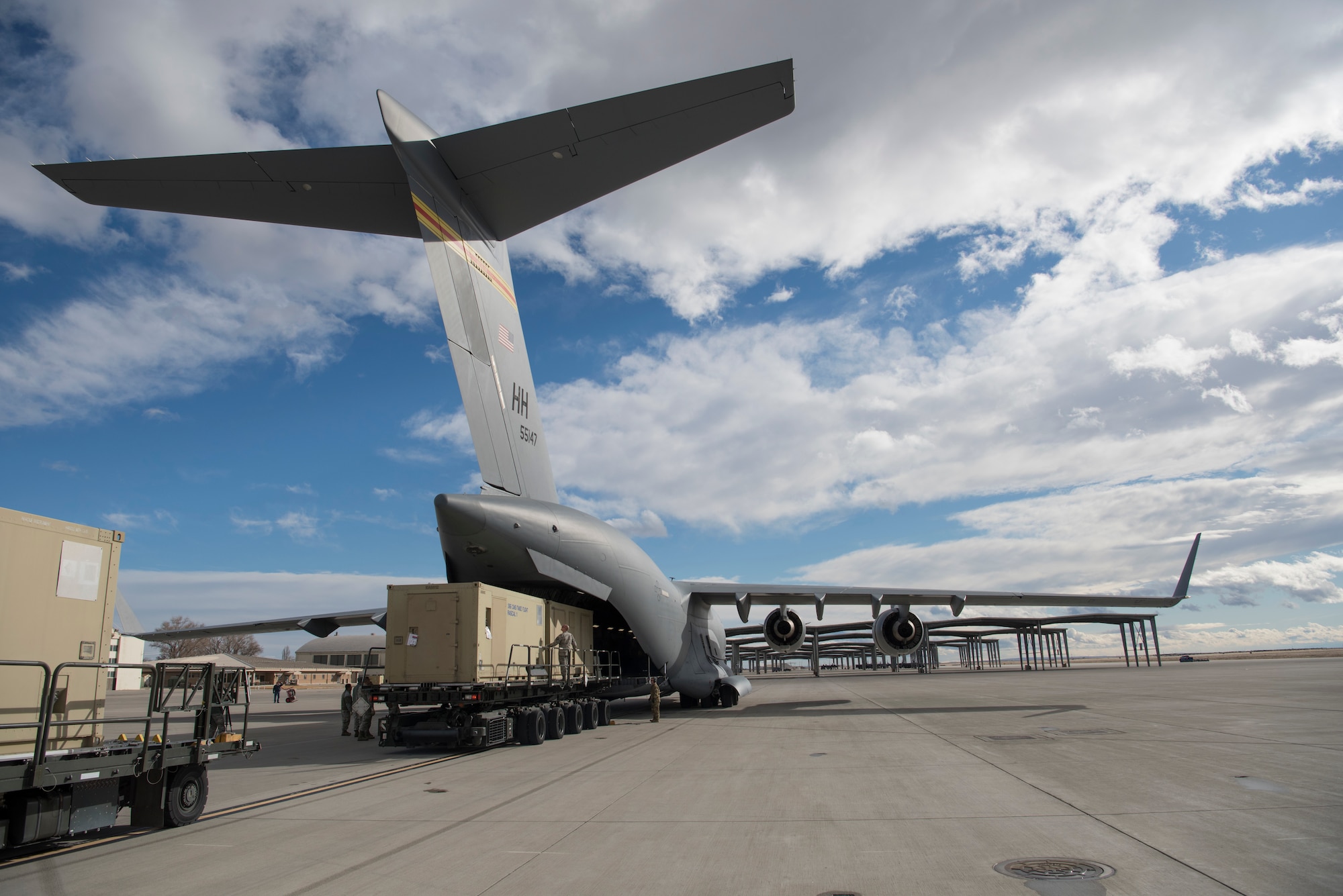 A C-17 Globemaster III is being loaded with a Rapid Assistance Support for Calibration (RASCAL) unit to deploy to Joint Base Pearl Harbor - Hickam, Hawaii Jan. 17, 2019, from Mountain Home Air Force Base. The Air Force only has two RASCALs capable of deployment. (U.S. Air Force photo by Airman First Class Andrew Kobialka)