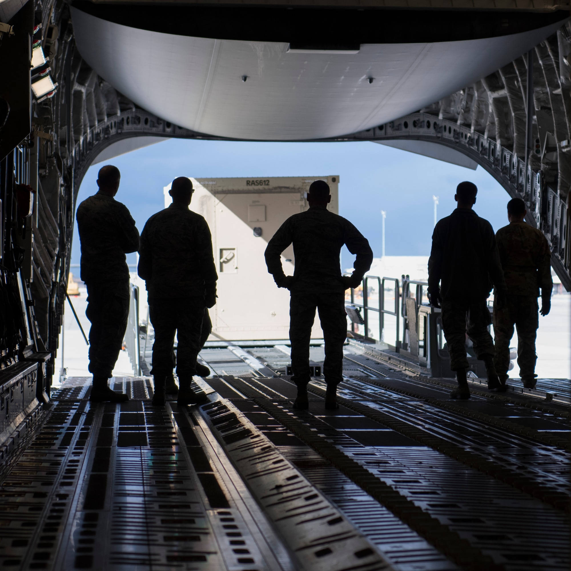 Airmen watch a Rapid Assistance Support for Calibration (RASCAL) load onto a C-17 Globemaster III Jan. 17, 2019, at Mountain Home Air Force Base, Idaho. The RASCAL, which is one of two of its kind in the Air Force, is deploying for the first time in 10 years. (U.S. Air Force photo by Airman First Class Andrew Kobialka)