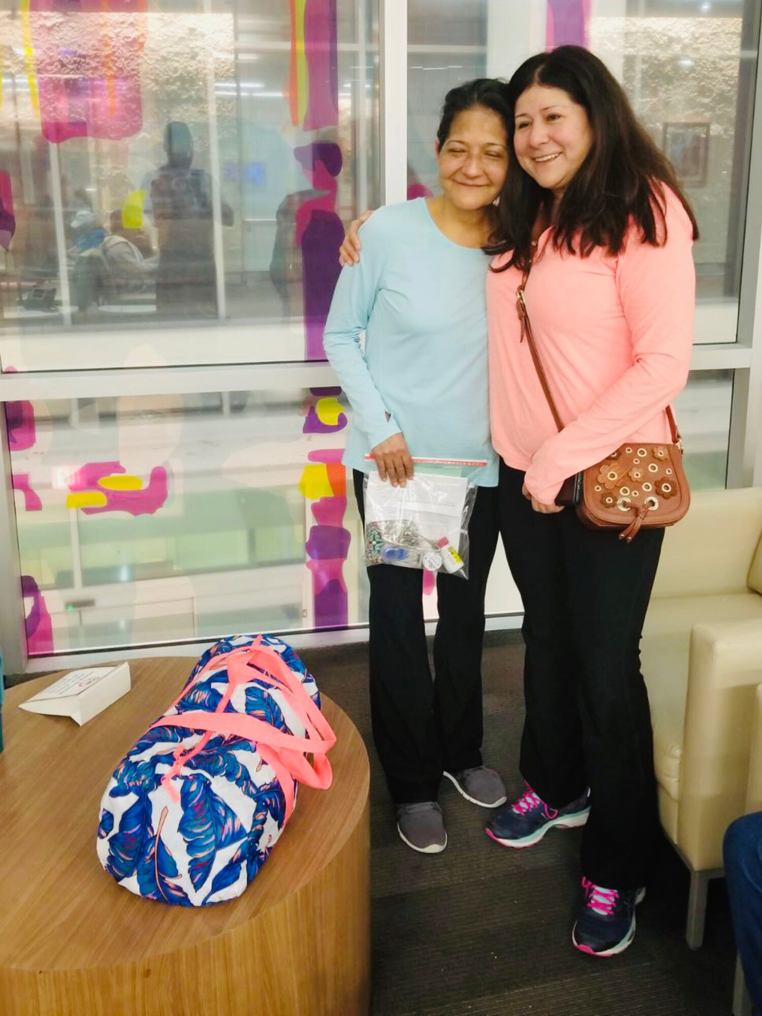 Sisters share a hug pre-surgery