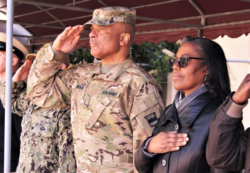 (Left to right) Chief Warrant Officer 4 Phillip Brashear, the command CWO for the 80th Training Command (TASS), and his wife Sandra attend the Brashear Conference Center flag-raising ceremony at Joint Expeditionary Base Little Creek-Fort Story, Virginia, April 1, 2019, honoring his late father Master Chief Boatswain's Mate Carl Maxie Brashear.